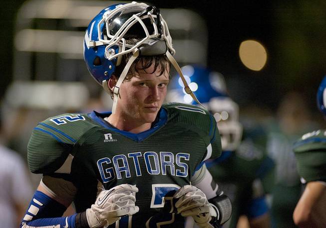 Green Valley wide receiver Sean Squires looks dejectedly toward the camera from the sidelines near the end of the first half of play on Friday night that saw the Gators fall quickly behind the Basha Bears 27-3. The visitors from Chandler, Arizona won the game handily 41-17.